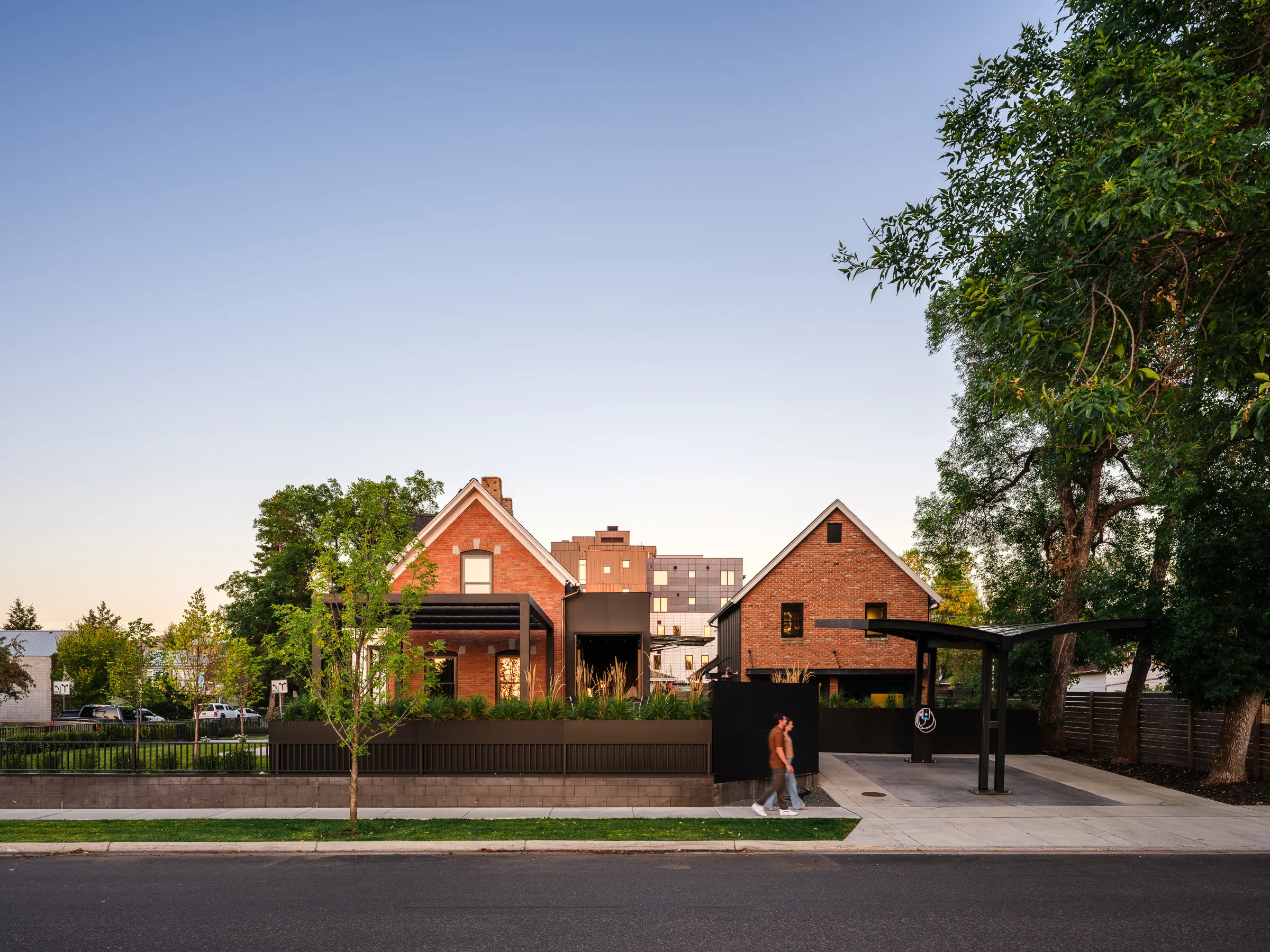 The Rouse House compound — street view at dusk